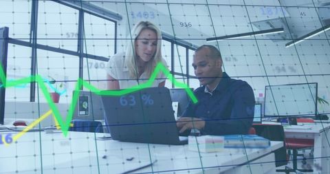 Diverse Team Analyzing Financial Growth Statistics in Modern Office