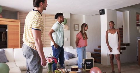 Friends Celebrating New Job with Dance and Joy at Home