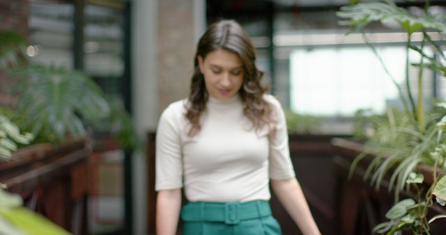 Confident Young Woman in Modern Office Corridor - Download Free Stock Images Pikwizard.com