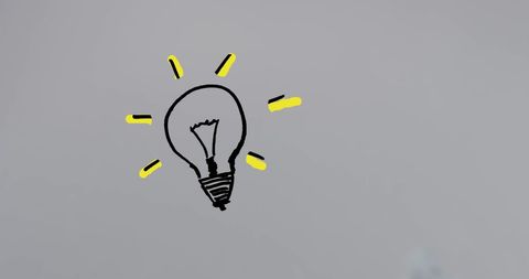 Hand-drawn light bulb illustration with yellow rays on white background