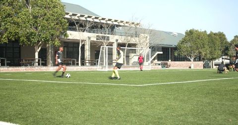 Teen Soccer Players Energized on School Field