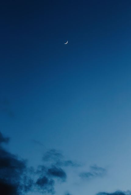 Crescent Moon in Twilight Sky with Storm Clouds - Download Free Stock Photos Pikwizard.com