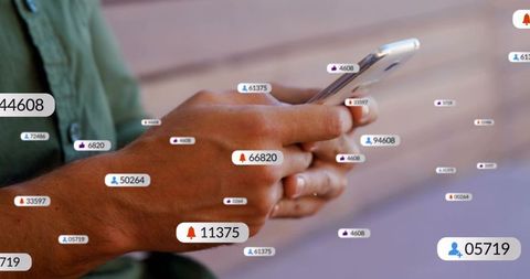Mid-adult man tapping smartphone showing notification badges and social metrics closeup