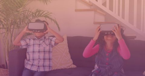 Children exploring virtual reality experiences indoors