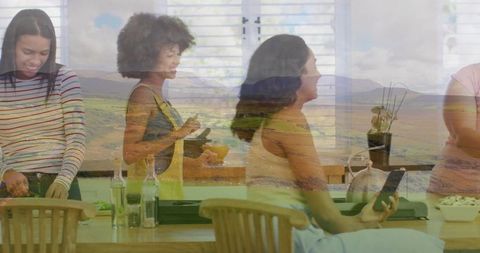 Friends Cooking Together with Scenic Mountain Overlay