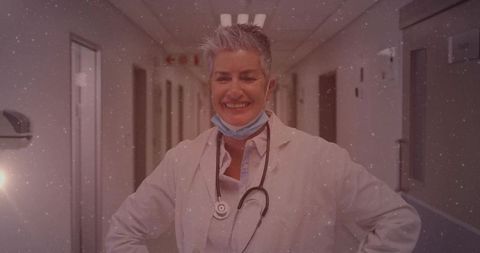 Senior Female Doctor in Hospital Corridor with Stethoscope and Mask