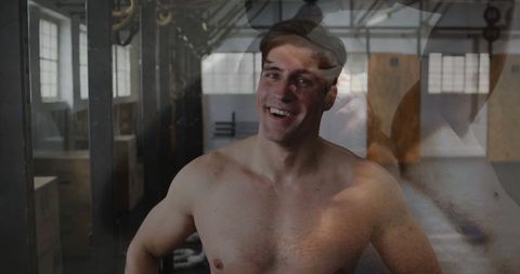 Athlete Smiling Post-Workout in Industrial Gym Interior
