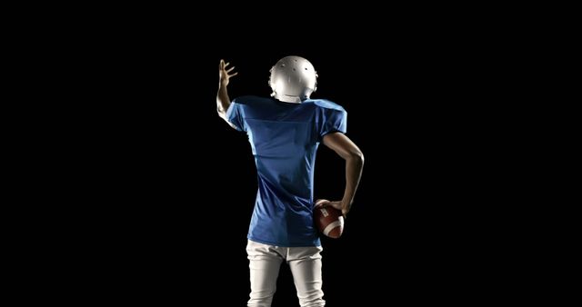 American Football Player Preparing Throw Isolated on Black - Download Free Stock Images Pikwizard.com