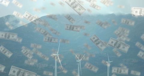 Dollar bills falling over wind turbines in mountainous landscape