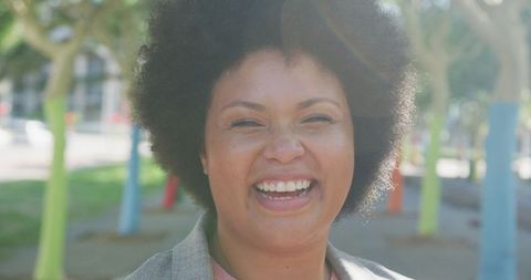 Joyful Biracial Woman Embracing Body Inclusivity Outdoors