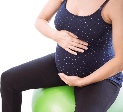 pregnant woman sitting on bright green exercise ball at home with hands on belly, transparent - Download Free Stock Videos Pikwizard.com