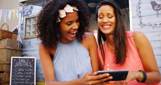 Cheerful Friends Enjoying Moments with Smartphone Outdoors - Download Free Stock Images Pikwizard.com