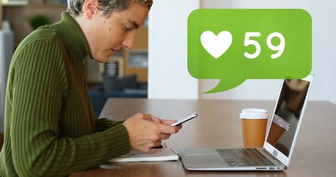 Woman Engaging on Social Media Using Mobile and Laptop