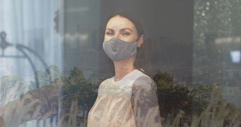 Woman in Mask Reflecting Urban and Nature Harmony