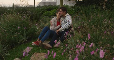 Romantic Couple Embracing in Twilight Garden Scene