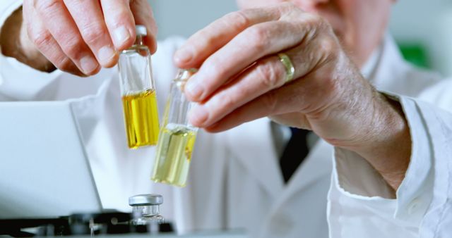 Scientist Conducting Chemical Experiments with Test Tubes in Lab - Download Free Stock Images Pikwizard.com