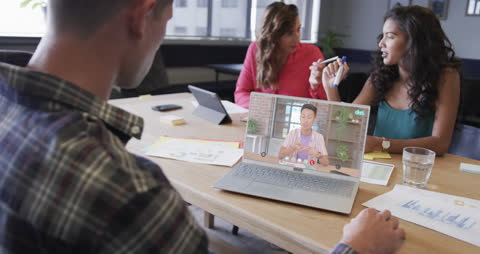 Diverse Team Engaged in Business Video Meeting
