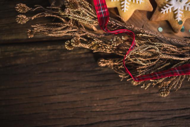 Close-up of christmas decoration on wooden plank