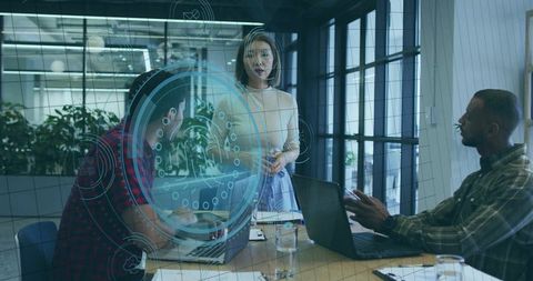 Woman Leading Tech Team Presentation with Augmented HUD in Modern Glass Office, Collaboration Focuse