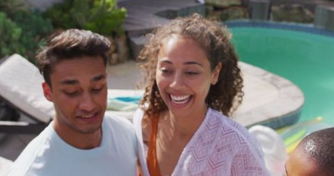 Diverse Friends Celebrating at Pool Party with Cheers