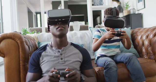Father and Son Using Virtual Reality Headsets in Living Room - Download Free Stock Images Pikwizard.com
