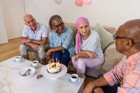Senior Friends Celebrate Birthday With Cake and Coffee
