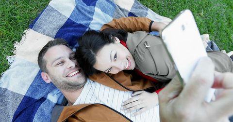 Smiling Couple Enjoying Picnic Outdoors Taking a Selfie - Download Free Stock Images Pikwizard.com