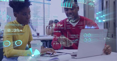Team analyzing financial dashboards with holographic data overlay on laptop screen