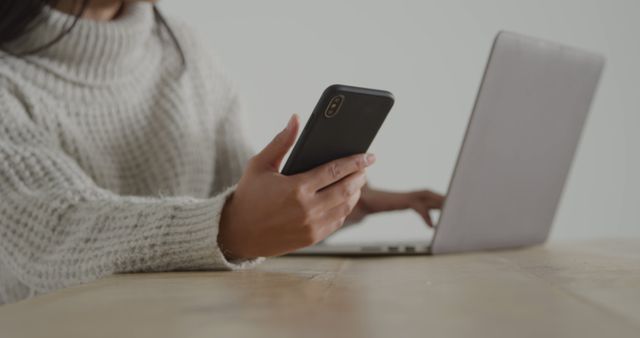 Woman Using Smartphone and Laptop at Work Desk - Download Free Stock Images Pikwizard.com