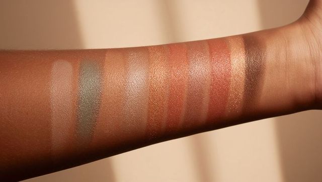 Diverse makeup palette swatches on brown skin