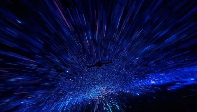 Silhouette spaceship racing through warp corridor with radial light streaks and nebula