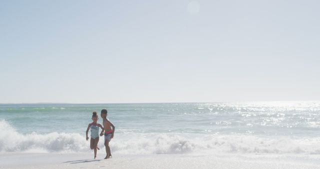 Children Playing on Sunny Beach - Download Free Stock Images Pikwizard.com