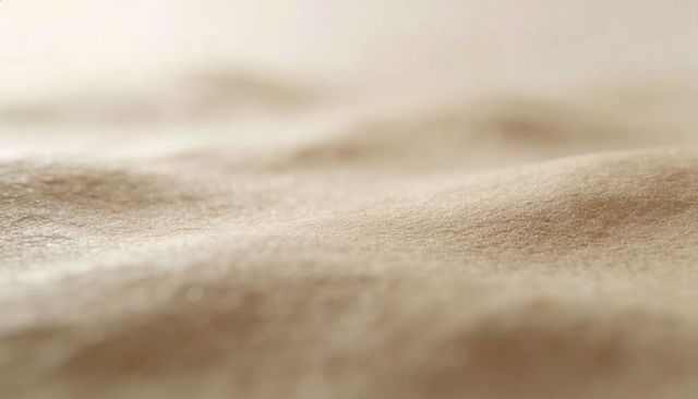 Macro close-up of human skin texture showing pores and fine vellus hairs under soft light