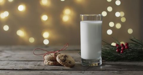 Festive Milk and Cookies with Holiday Lights Background - Download Free Stock Images Pikwizard.com
