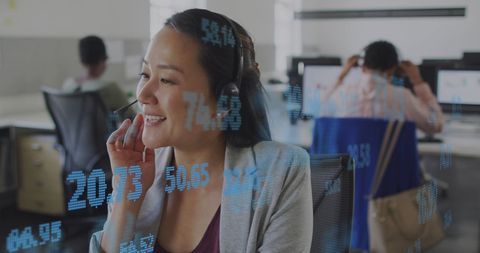 Smiling Businesswoman Analyzing Financial Data in Modern Office