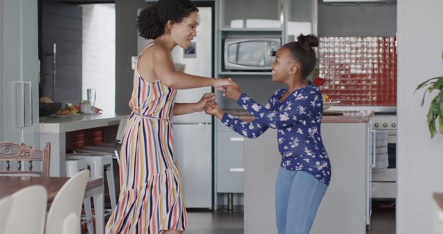 Mother and Daughter Enjoying Quality Time Dancing at Home - Download Free Stock Images Pikwizard.com