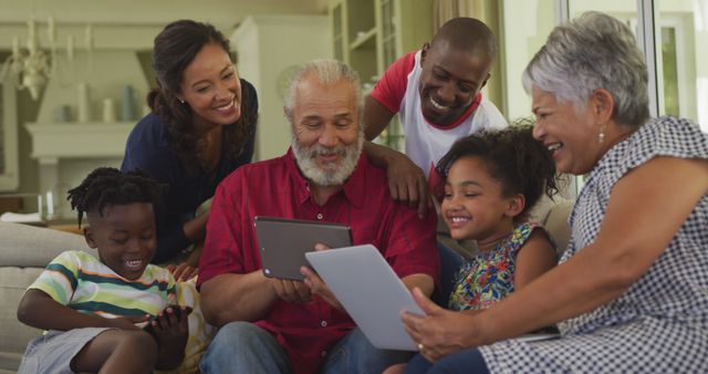 Multigenerational Family Using Digital Tablets, Enjoying Leisure Time Together - Download Free Stock Images Pikwizard.com