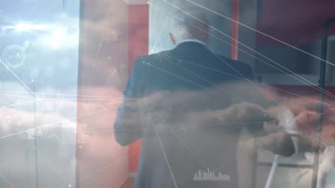 Businessman Communicating with Digital Network Graphics