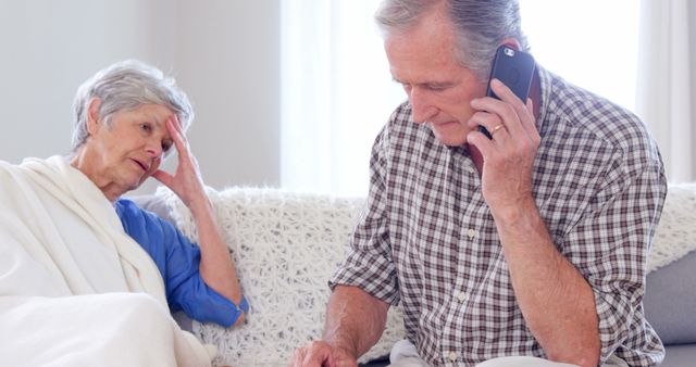 Senior Couple Making an Emergency Call in Living Room - Download Free Stock Images Pikwizard.com