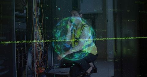 Female technician kneeling routing network cables in data center with holographic globe