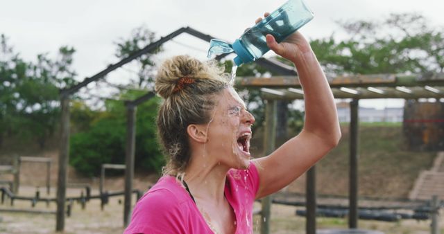 Female Athlete Refreshing Herself During Intense Outdoor Workout - Download Free Stock Images Pikwizard.com