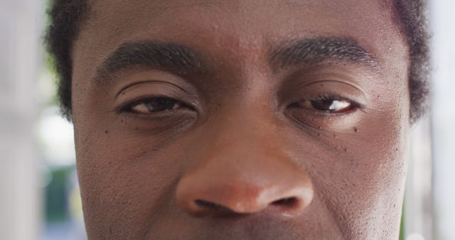 Close-up of a Thoughtful African American Man with Focused Eyes - Download Free Stock Images Pikwizard.com