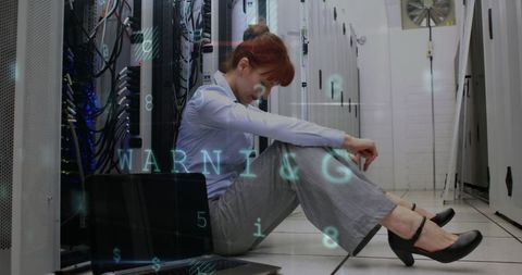 Frustrated professional in server room facing technical challenges