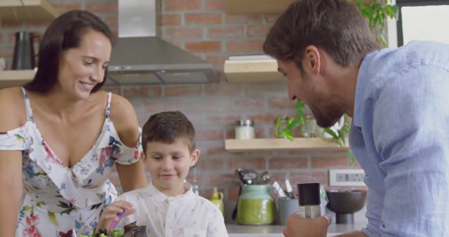 Smiling Family Enjoying Healthy Meal Preparation in Modern Kitchen - Download Free Stock Images Pikwizard.com