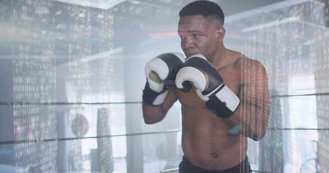 Boxer holding tight guard in ring with digital code overlay, representing data-driven training