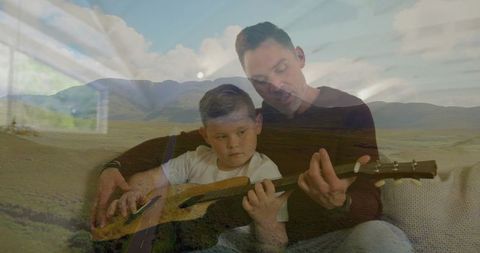 Father Teaching Son Guitar in Cozy Living Room Setting