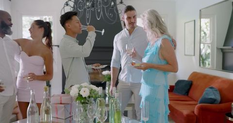 Elegant Wedding Celebration with Friends Enjoying Drinks and Appetizers