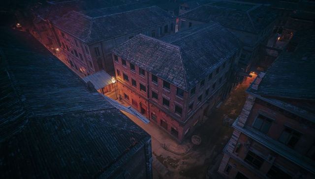 Misty Alley at Night with Historic Brick Buildings