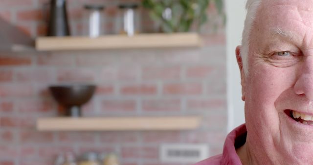 Smiling Senior Man in Kitchen with Brick Wall Background - Download Free Stock Images Pikwizard.com