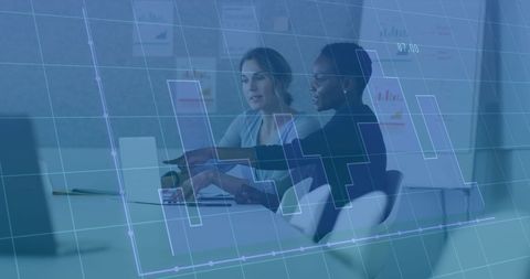 businesswomen discussing financial data with digital overlay - Download Free Stock Images Pikwizard.com